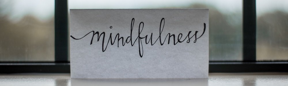 the word mindfulness on a piece of paper